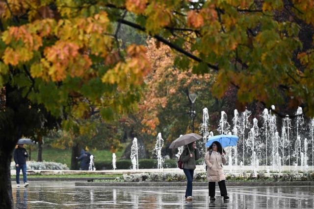 Pedestrians walk under their umbrellas on a rainy day in Sofia on October 30, 2026. (Photo by Nikolay Doychinov / AFP)