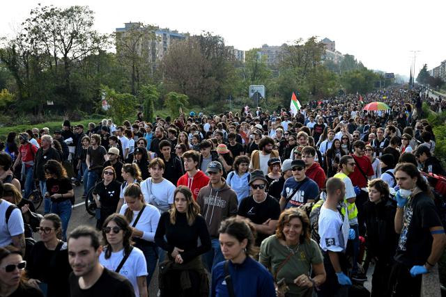 Protesters march during a demonstration part of a nationwide day of strikes and protests as school and university students demand more funding for schools and support for housing, in Milan, northern Italy on October 30, 2026. Students have been protesting for weeks, setting up tent camps and occupying schools to make their demands heard, matching similar movements across the border in France. The Italian protests have taken place alongside those of truck drivers and farmers over the spike in fuel prices and the cost of living, as well as rising defence spending. (Photo by PIERO CRUCIATTI / AFP)