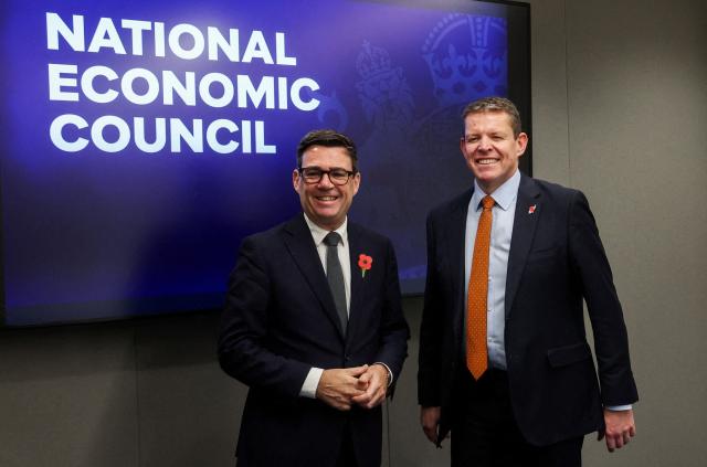 Britain's Prime Minister Andy Burnham reacts with Welsh First Minister Rhun ap Iorwerth during a meeting at the National Economic Council in Glasgow on October 30, 2026, that focuses on driving growth in every region of the United Kingdom. (Photo by Russell Cheyne / POOL / AFP)