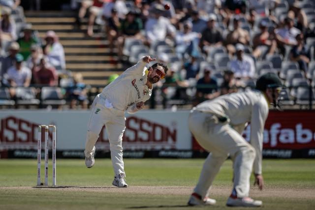 Australia's Travis Head delivers a ball on day four of the third Test match between South Africa and Australia at Newlands stadium in Cape Town on October 30, 2026. (Photo by Marco Longari / AFP)