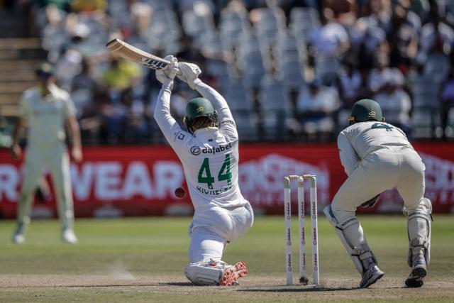 South Africa's Ryan Rickelton is hit by a ball on day four of the third Test match between South Africa and Australia at Newlands stadium in Cape Town on October 30, 2026. (Photo by Marco Longari / AFP)