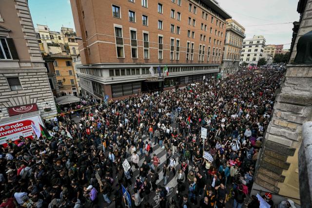People take part in a demonstration part of a nationwide day of strikes and protests as school and university students demand more funding for schools and support for housing in Rome on October 30, 2026. Students have been protesting for weeks, setting up tent camps and occupying schools to make their demands heard, matching similar movements across the border in France. The Italian protests have taken place alongside those of truck drivers and farmers over the spike in fuel prices and the cost of living, as well as rising defence spending. (Photo by Andreas SOLARO / AFP)