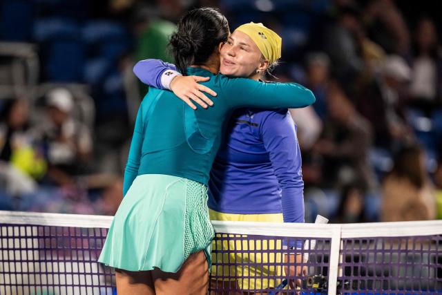 Russia's Diana Shnaider (R) embraces Philippines' Alexandra Eala after their quarter-final match at the WTA Pan Pacific Open tennis tournament at Ariake Coliseum in Tokyo on October 28, 2026. (Photo by Yuichi YAMAZAKI / AFP)