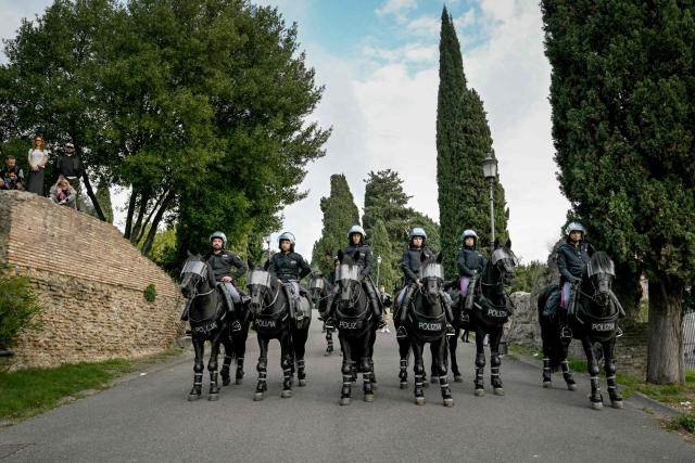 Mounted police stand during a demonstration part of a nationwide day of strikes and protests as school and university students demand more funding for schools and support for housing in Rome on October 30, 2026. Students have been protesting for weeks, setting up tent camps and occupying schools to make their demands heard, matching similar movements across the border in France. The Italian protests have taken place alongside those of truck drivers and farmers over the spike in fuel prices and the cost of living, as well as rising defence spending. (Photo by Andreas SOLARO / AFP)