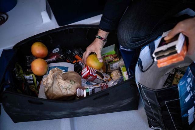 French skipper Fabrice Amedeo organises his meals as he restocks his Imoca monhull Fdj United - Ocean Calling in the harbour of Saint-Malo, northwestern France on October 30, 2026, a few days prior to the start of La Route du Rhum - Destination Guadeloup solo sailing race from Saint-Malo to Pointe-a-Pitre in the French overseas island of Guadeloupe. (Photo by Lou BENOIST / AFP)