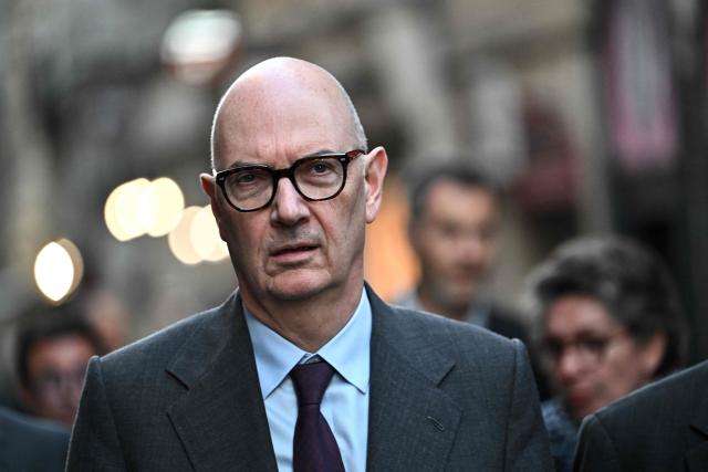 France's Economy, Finances and Industry Minister Roland Lescure walks along a street during a visit to the stores damaged in recent nationwide demonstrations, in Bordeaux, south-western France, on October 30, 2026. France has been rocked by widespread anger over the rising cost of living and inequality, with authorities warning of a "very high risk of public disorder" this weekend, after protests two weeks ago degenerated into some of the country's worst rioting in years. (Photo by Christophe ARCHAMBAULT / AFP)