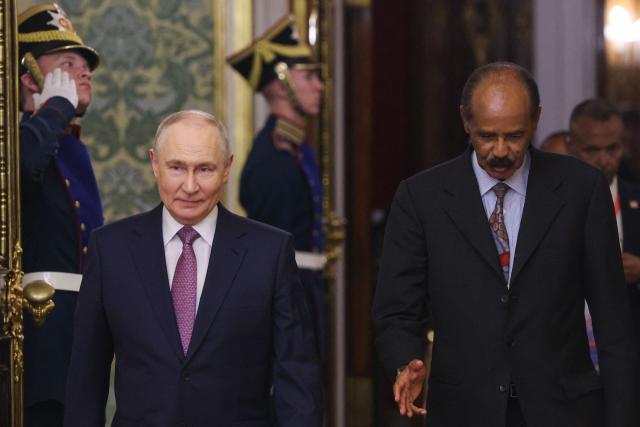 Russia's President Vladimir Putin (L) and Eritrea's President Isaias Afwerki (R) arrive for their talks on the sidelines of the Russia-Africa summit in Moscow on October 30, 2026. (Photo by MAXIM SHIPENKOV / POOL / AFP)
