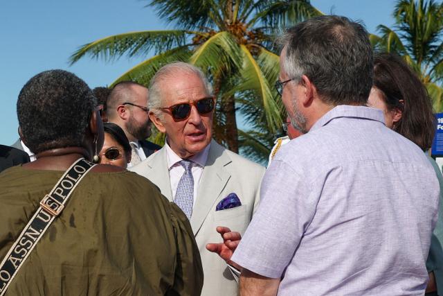 Britain's King Charles III (C) visits the Kingston Seawall Esplanade in Georgetown on October 30, 2026. King Charles III is on an official visit to Guyana. (Photo by Isabel Infantes / POOL / AFP)
