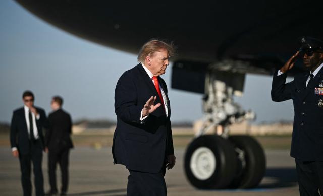 US President Donald Trump walks to board Air Force One at Joint Base Andrews, Maryland, on October 30, 2026. President Trump is travelling to Florida to speak at a midterm campaign rally. (Photo by Brendan SMIALOWSKI / AFP)