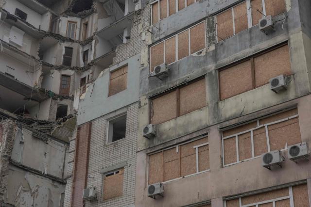 A residential building which was heavily damaged in previous air attacks is seen during a temporary ceasefire in the southern Kherson region, in the city of Kherson, southern Ukraine, on October 30, 2026, amid the Russian invasion of Ukraine. The respite from a fragile ceasefire in Oleshky, a Russian-occupied town in southern Ukraine ravaged by food and medicine shortages, to pave the way for evacuations and humanitarian aid deliveries and due to end on November 1 evening, has also given residents in the major southern Ukrainian city of Kherson relief from daily drone attacks. The truce has held despite unabated attacks elsewhere in Ukraine. (Photo by Roman PILIPEY / AFP)
