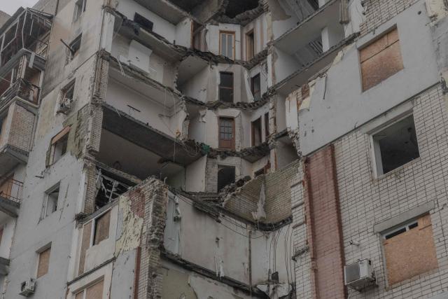 A residential building which was heavily damaged in previous air attacks is seen during a temporary ceasefire in the southern Kherson region, in the city of Kherson, southern Ukraine, on October 30, 2026, amid the Russian invasion of Ukraine. The respite from a fragile ceasefire in Oleshky, a Russian-occupied town in southern Ukraine ravaged by food and medicine shortages, to pave the way for evacuations and humanitarian aid deliveries and due to end on November 1 evening, has also given residents in the major southern Ukrainian city of Kherson relief from daily drone attacks. The truce has held despite unabated attacks elsewhere in Ukraine. (Photo by Roman PILIPEY / AFP)