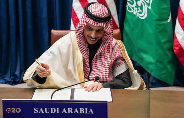 Saudi Arabia's Foreign Minister Faisal bin Farhan signs Expo 2030 Riyadh Participation Contract as he meets with US Secretary of State Marco Rubio (not pictured) during the G20 foreign ministers' meeting in Atlanta, Georgia on October 30, 2026. US Secretary of State Marco Rubio is hosting his G20 counterparts, including Russia's Sergei Lavrov, for talks that are expected to be fractious, with wars in Ukraine and Iran and surging energy prices fanning discord. The foreign ministers' meeting in Atlanta, taking place just days before crucial US midterm elections, will set the stage for a December G20 leaders' summit in Miami at President Donald Trump's Doral resort. (Photo by Megan Varner / POOL / AFP)