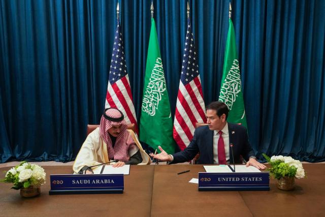 US Secretary of State Marco Rubio and Saudi Arabia's Foreign Minister Faisal bin Farhan talk as they sign documents for Expo 2030 Riyadh Participation Contract as they meet during the G20 Foreign Ministers' Meeting in Atlanta, Georgia, on October 30, 2026. US Secretary of State Marco Rubio is hosting his G20 counterparts, including Russia's Sergei Lavrov, for talks that are expected to be fractious, with wars in Ukraine and Iran and surging energy prices fanning discord. The foreign ministers' meeting in Atlanta, taking place just days before crucial US midterm elections, will set the stage for a December G20 leaders' summit in Miami at President Donald Trump's Doral resort. (Photo by Megan Varner / POOL / AFP)