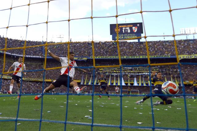 (FILES) Boca Juniors' Uruguayan forward #16 Miguel Merentiel scores his team's second goal during the Argentine Professional Football League 2025 Clausura Tournament match between Boca Juniors and River Plate at the La Bombonera Stadium in Buenos Aires on November 9, 2025. Boca Juniors and River Plate, Argentina's two most popular clubs, will face off on November 1st at La Bombonera in the latest edition of the Superclásico, a matchup that could prove decisive in the race for the Clausura tournament title. (Photo by ALEJANDRO PAGNI / AFP)