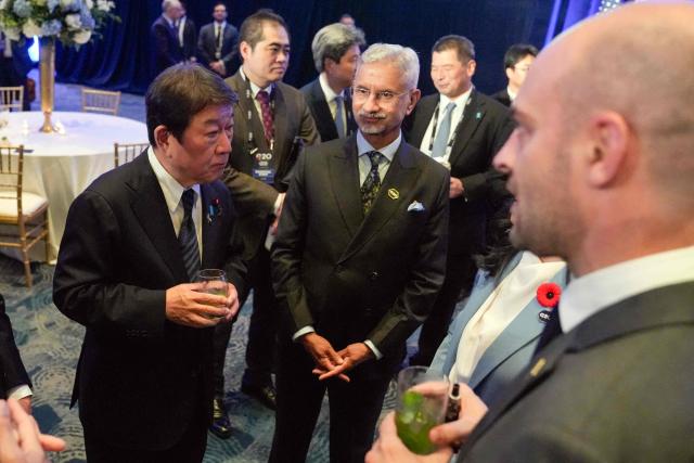 Japanese Foreign Minister Toshimitsu Motegi (L) speaks with attendees during the G20 foreign ministers' meeting in Atlanta, Georgia on October 30, 2026. US Secretary of State Marco Rubio is hosting his G20 counterparts, including Russia's Sergei Lavrov, for talks that are expected to be fractious, with wars in Ukraine and Iran and surging energy prices fanning discord. The foreign ministers' meeting in Atlanta, taking place just days before crucial US midterm elections, will set the stage for a December G20 leaders' summit in Miami at President Donald Trump's Doral resort. (Photo by Megan Varner / POOL / AFP)