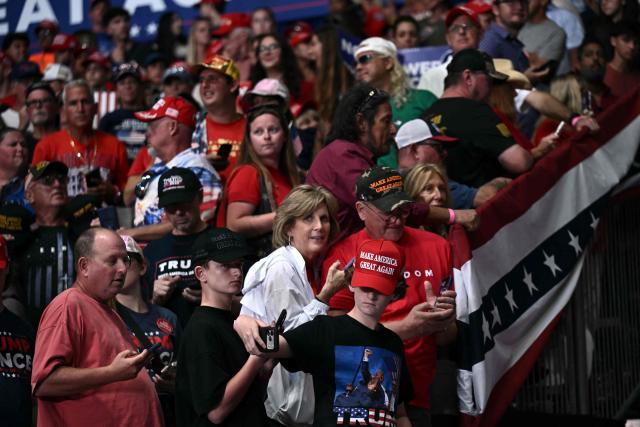 Supporters wait for the arrival of US President Donald Trump to speak at a midterm campaign rally at the Ocean Center in Daytona Beach, Florida on October 30, 2026. (Photo by Brendan SMIALOWSKI / AFP)