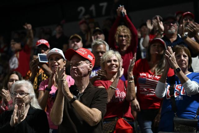 Supporters applaud as US President Donald Trump speaks at a midterm campaign rally at the Ocean Center in Daytona Beach, Florida on October 30, 2026. (Photo by Brendan SMIALOWSKI / AFP)