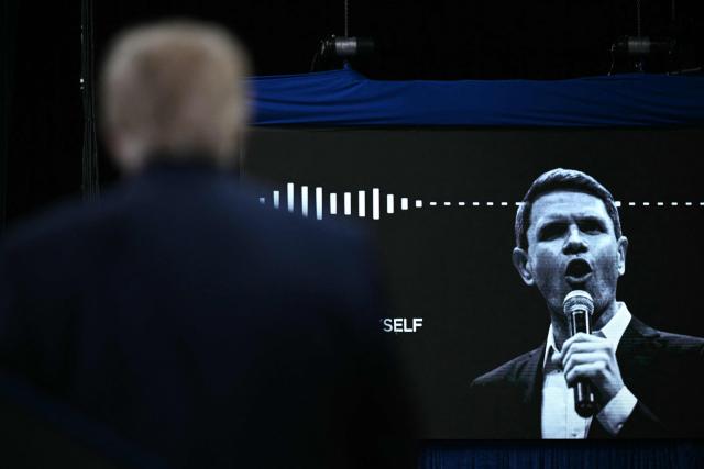 A video of Democratic candidate for the US Senate James Talarico of Texas is shown as US President Donald Trump speaks at a midterm campaign rally at the Ocean Center in Daytona Beach, Florida on October 30, 2026. (Photo by Brendan SMIALOWSKI / AFP)