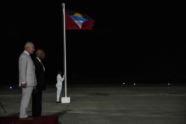 Britain's King Charles III stands alongside the Governor-General of Antigua and Barbuda, Sir Rodney Williams, during a welcoming ceremony upon his arrival at VC Bird International Airport in St. John's, on October 30, 2026. (Photo by Ben Stansall / POOL / AFP)
