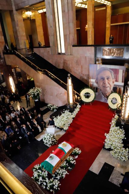A general view shows the coffin of former Mexican presidential candidate Cuauhtemoc Cardenas draped in the Mexican flag during a tribute ceremony at the Palace of Fine Arts in Mexico City on October 30, 2026. Hundreds of Mexicans paid tribute to Cardenas, a three-time presidential candidate, former Mexico City mayor and leading figure of Mexico's modern left, who died on October 28 at the age of 92. (Photo by Barny  Gomez / AFP)