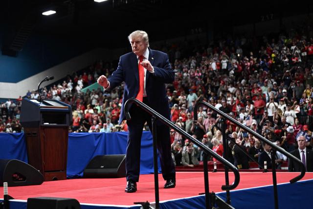 US President Donald Trump dances after speaking at a midterm campaign rally at the Ocean Center in Daytona Beach, Florida on October 30, 2026. (Photo by Brendan SMIALOWSKI / AFP)