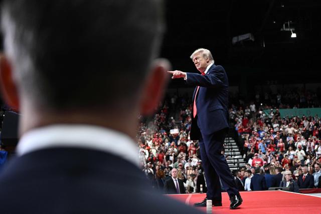 US President Donald Trump gestures to the crowd after speaking at a midterm campaign rally at the Ocean Center in Daytona Beach, Florida on October 30, 2026. (Photo by Brendan SMIALOWSKI / AFP)