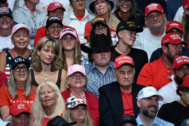 Supporters watch as US President Donald Trump speaks at a midterm campaign rally at the Ocean Center in Daytona Beach, Florida on October 30, 2026. (Photo by Brendan SMIALOWSKI / AFP)