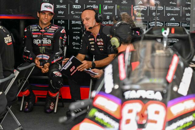 Aprilia Racing's Spanish rider Jorge Martin (L) looks on before the second free practice session of the MotoGP Malaysian Grand Prix at the Sepang International Circuit in Sepang on October 31, 2026. (Photo by MOHD RASFAN / AFP)