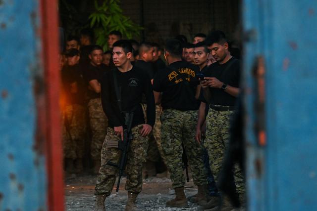 El Salvador Army soldiers are seen at their encampment in the Tabarre neighborhood after their arrival in Port-au-Prince, Haiti, on October 30, 2026. Over 2,000 troops have flown in from El Salvador to Haiti in little over a week, effectively doubling the contingent of foreign soldiers operating in the Caribbean island nation. President Nayib Bukele ordered the rapid deployment after four Salvadoran personnel, who were operating in Haiti as part of a UN-backed anti-gang force, went missing in an ambush attack on October 18. (Photo by Clarens SIFFROY / AFP)
