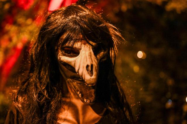An actor dressed as the character "La Siguanaba" performs in "Legends of Guatemala" in the Cerrito del Carmen neighborhood ahead of the Day of the Dead celebrations in Guatemala City on October 30, 2026. (Photo by Johan ORDONEZ / AFP)