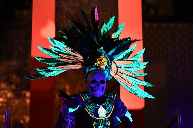 An actor performs in "Legends of Guatemala" in the Cerrito del Carmen neighborhood ahead of the Day of the Dead celebrations in Guatemala City on October 30, 2026. (Photo by Johan ORDONEZ / AFP)