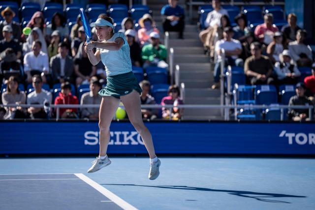 Uzbekistan's Kamilla Rakhimova hits a return against Canada's Leylah Fernandez during their semi-final match at the WTA Pan Pacific Open tennis tournament at Ariake Coliseum in Tokyo on October 31, 2026. (Photo by Yuichi YAMAZAKI / AFP)