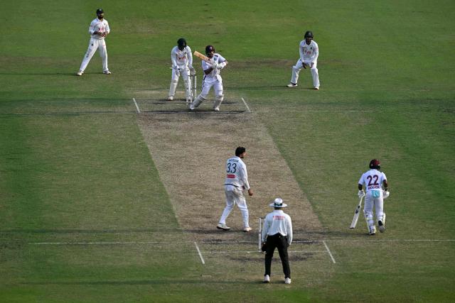 West Indies' Brandon King (C, top) watches the ball after playing a shot during the fourth day of the first test cricket match between Bangladesh and West Indies at the Sher-e-Bangla National Stadium in Mirpur on October 31, 2026. (Photo by Salahuddin Ahmed / AFP)
