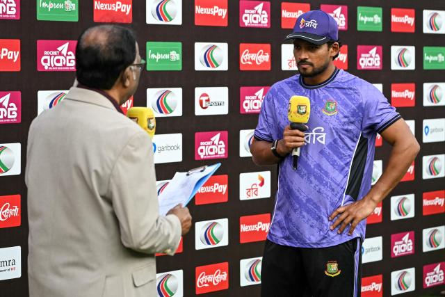 Bangladesh's captain Najmul Hossain Shanto (R) speaks during a presentation ceremony after his team's loss in the first test cricket against the West Indies at the Sher-e-Bangla National Stadium in Mirpur on October 31, 2026. (Photo by Salahuddin AHMED / AFP)