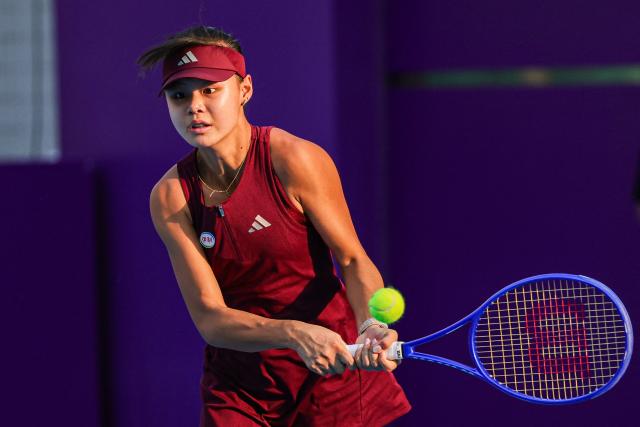China's Sun Xinran hits a return to Britain's Harriet Dart during their women's singles semi-final match at the Guangzhou Open tennis tournament in Guangzhou, China's southern Guangdong province on October 31, 2026. (Photo by AFP) / China OUT