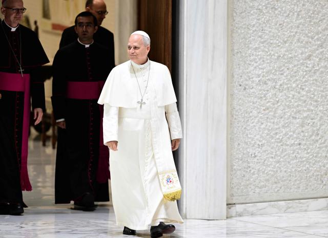 Pope Leo XIV arrives for an audience with delegations from Villanova University and the University of Notre Dame at the Paul VI Audience Hall in the Vatican on October 31, 2026. (Photo by TIZIANA FABI / AFP)