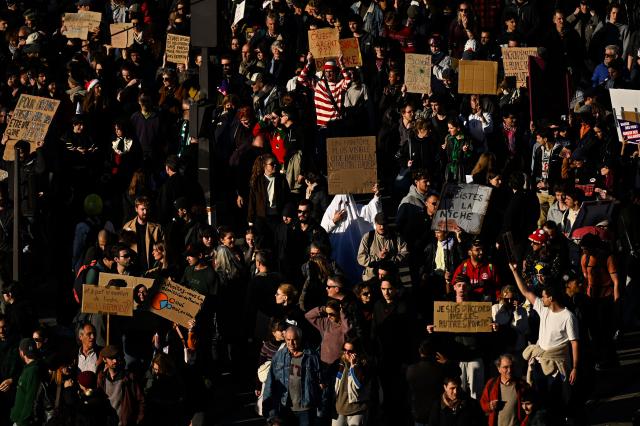 Protesters arrive in Porte de Vincennes as they take part in a protest march during nationwide demonstrations over the rising cost of living and inequality organised by Yellow Vest movement, labour unions and high school and university students, in Paris on October 31, 2026. "Exceptional" security deployment with 70,000 police officers and gendarmes mobilized and an alarmist tone: for Act III of the protests against the high cost of living, right in the middle of Halloween festivities, the authorities fear a repeat of the October 17 nightmare. France has been rocked by widespread anger over the rising cost of living and inequality. (Photo by JULIEN DE ROSA / AFP)