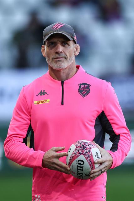 Stade Français' English head coach Paul Gustard looks on as his players warm up before the French Top14 rugby union match between Stade Francais Paris and La Rochelle at the Jean-Bouin Stadium in Paris on October 31, 2026. (Photo by Anne-Christine POUJOULAT / AFP)