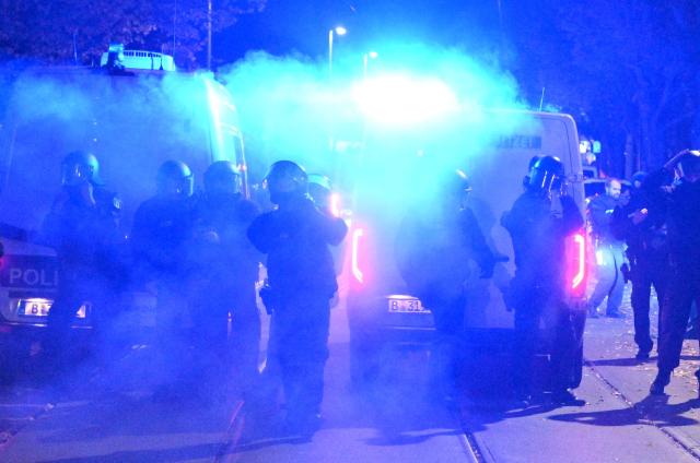 Flares are lit on the sidelines of a demonstration organised by "GenZ regelt!" (Gen Z has got this!) in Berlin on October 31, 2026. The German demonstrations have been inspired by similar movements across Europe, including in France and Italy, which have seen young protesters voice anger at political elites whom they accuse of ignoring their concerns. (Photo by RALF HIRSCHBERGER / AFP)