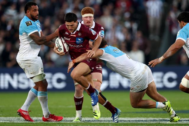 Bordeaux' French centre Nicolas Depoortere (C) is tackled by Bayonne' Argentinian hook Facundo Bosch (R) during the French Top14 rugby union match between Union Bordeaux Bègles (UBB) and Aviron Bayonnais at the Chaban-Delmas stadium in Bordeaux, south-western France, on October 31, 2026. (Photo by ROMAIN PERROCHEAU / AFP)