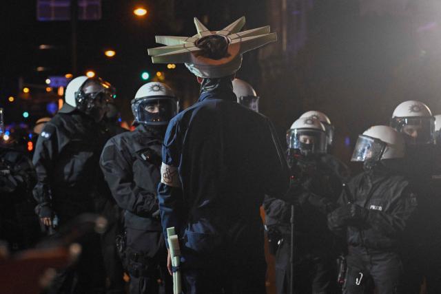 Protesters and riot police stand off after a demonstration organised by "GenZ regelt!" (Gen Z has got this!) in Cologne on October 31, 2026. The German demonstrations have been inspired by similar movements across Europe, including in France and Italy, which have seen young protesters voice anger at political elites whom they accuse of ignoring their concerns. (Photo by INA FASSBENDER / AFP)