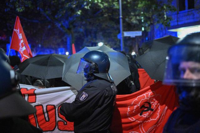 Riot police accompany a demonstration in Berlin on October 31, 2026. The German demonstrations have been inspired by similar movements across Europe, including in France and Italy, which have seen young protesters voice anger at political elites whom they accuse of ignoring their concerns. (Photo by RALF HIRSCHBERGER / AFP)