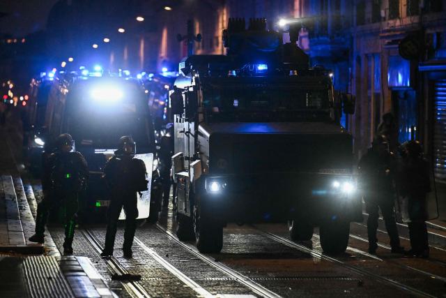 French gendarmes operate next to a French gendarmerie alongside "Centaure" multipurpose intervention vehicle (VIPG) during nationwide demonstrations over the rising cost of living and inequality organised by Yellow Vest movement, labour unions and high school and university students, in Bordeaux, southwestern France on October 31, 2026. "Exceptional" security deployment with 70,000 police officers and gendarmes mobilized and an alarmist tone: for Act III of the protests against the high cost of living, right in the middle of Halloween festivities, the authorities fear a repeat of the October 17 nightmare. France has been rocked by widespread anger over the rising cost of living and inequality. (Photo by Christophe ARCHAMBAULT / AFP)