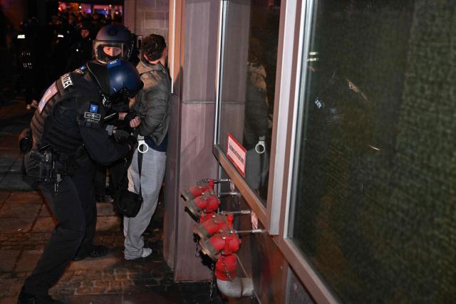 Riot Police detain a protester after a demonstration organised by "GenZ regelt!" (Gen Z has got this!) in Frankfurt am Mian on October 31, 2026. The German demonstrations have been inspired by similar movements across Europe, including in France and Italy, which have seen young protesters voice anger at political elites whom they accuse of ignoring their concerns. (Photo by Kirill KUDRYAVTSEV / AFP)