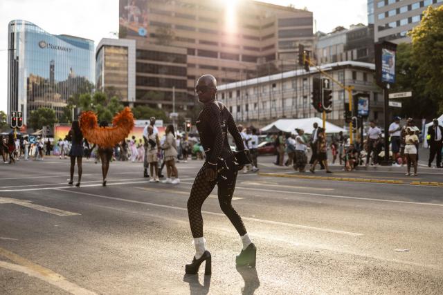 TOPSHOT - An attendee poses during Johannesburg Pride in Sandton, on October 31, 2026. People filled the streets of Sandton City in Johannesburg for Africa’s oldest Pride event, marking 37 years of protest, courage and celebration. Launched in 1990, before South Africa became a democracy, Johannesburg Pride has grown from an act of defiance under apartheid into a continental movement for equality. (Photo by ILARIA FINIZIO / AFP)