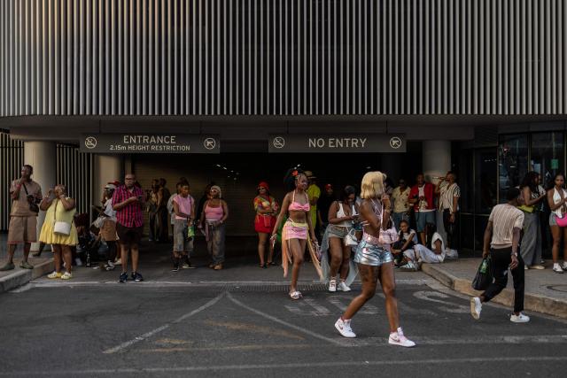 Attendees walk during Johannesburg Pride in Sandton, on October 31, 2026. People filled the streets of Sandton City in Johannesburg for Africa’s oldest Pride event, marking 37 years of protest, courage and celebration. Launched in 1990, before South Africa became a democracy, Johannesburg Pride has grown from an act of defiance under apartheid into a continental movement for equality. (Photo by ILARIA FINIZIO / AFP)