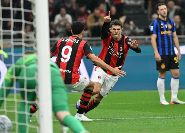 AC Milan's US forward #11 Christian Pulisic celebrates after scoring his team's first goal during the Italian Serie A football match between AC Milan and Inter Milan at the San Siro (Giuseppe Meazza) stadium in Milan, on October 31, 2026. (Photo by Stefano RELLANDINI / AFP)