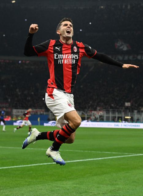 AC Milan's US forward #11 Christian Pulisic celebrates after scoring his team's first goal during the Italian Serie A football match between AC Milan and Inter Milan at the San Siro (Giuseppe Meazza) stadium in Milan, on October 31, 2026. (Photo by Stefano Rellandini / AFP)