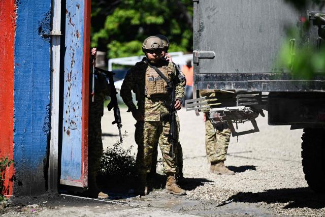 A Salvadoran Army soldier stands guard at their encampment in the Tabarre neighborhood after their arrival in Port-au-Prince,Haiti, on October 31,2026. Over 2,000 troops have flown in from El Salvador to Haiti in little over a week, effectively doubling the contingent of foreign soldiers operating in the Caribbean island nation. President Nayib Bukele ordered the rapid deployment after four Salvadoran personnel, who were operating in Haiti as part of a UN-backed anti-gang force, went missing in an ambush attack on October 18. (Photo by Clarens SIFFROY / AFP)