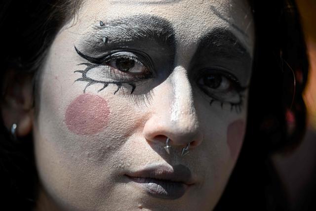 A participant poses for a picture during an LGBTIQ Pride parade in Caracas on October 31, 2025. (Photo by Federico PARRA / AFP)